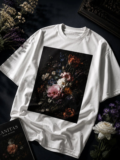 White t-shirt with a floral design on a dark background